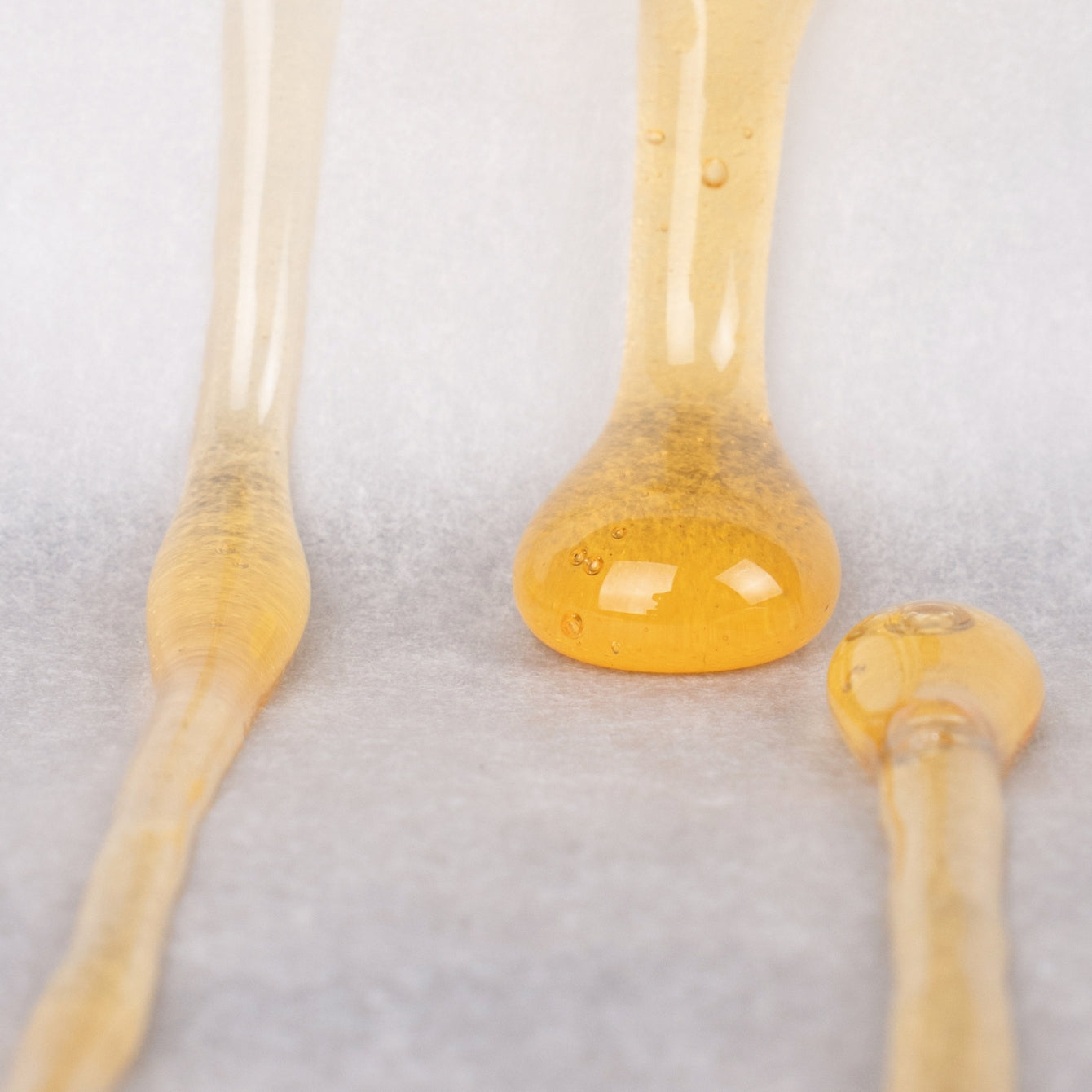 Closeup of rosin drips on parchment paper